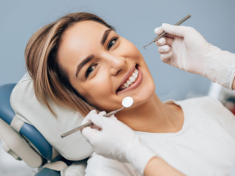 Happy patient smiling after dental treatment at Lake City Family Dental Care